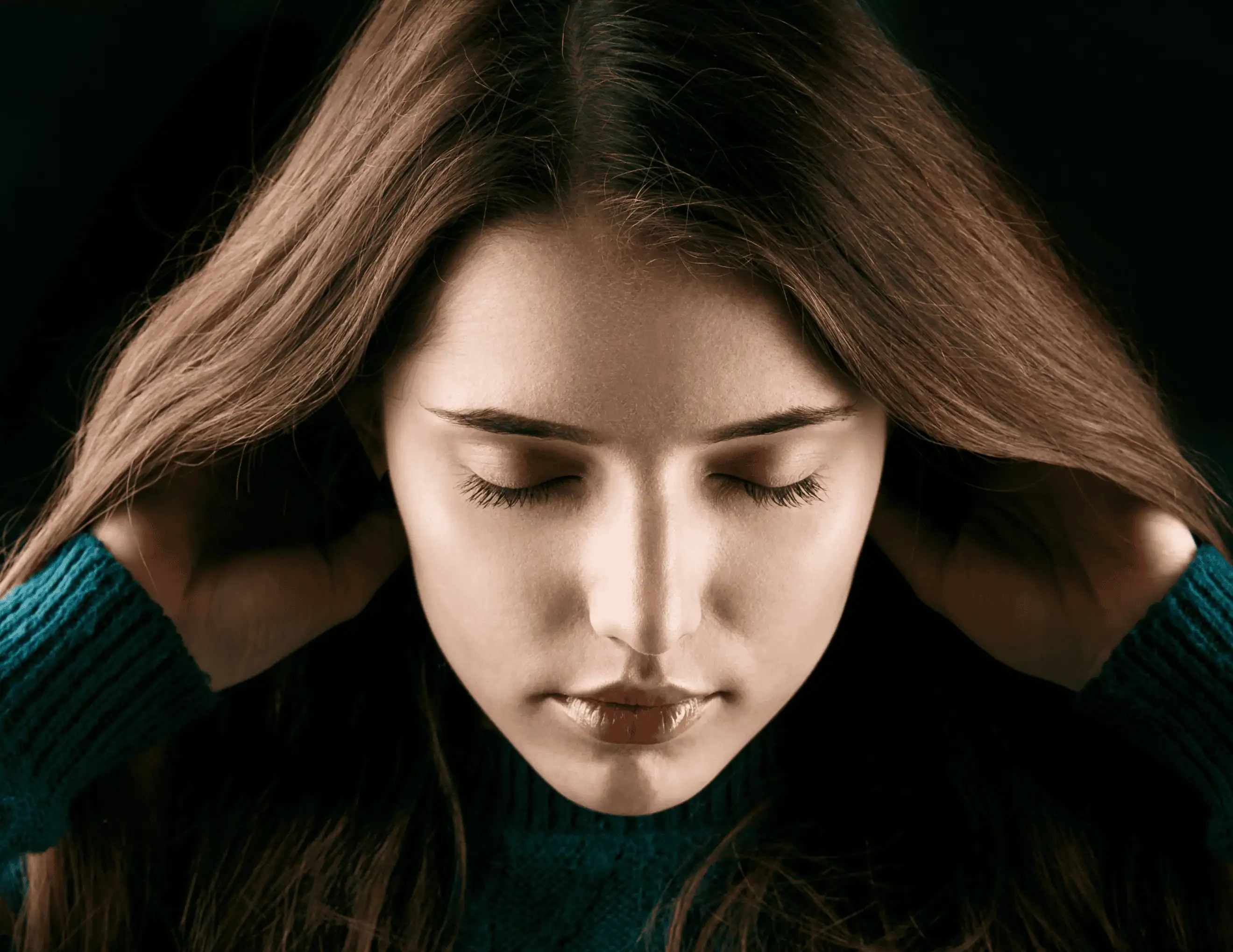 woman-holds-her-hair-up-posing-green-sweater Portrait of Charle Dewitt.